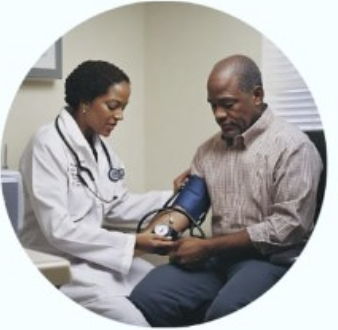 Doctor performing a blood pressure check during an occupational health medical